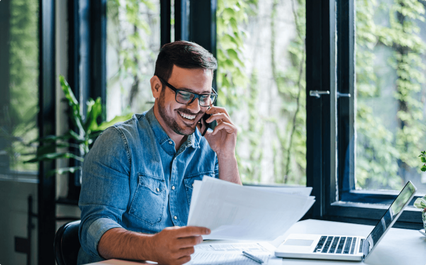 Portrait smiling young manager working remotely